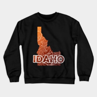 Colorful mandala art map of Idaho with text in brown and orange Crewneck Sweatshirt